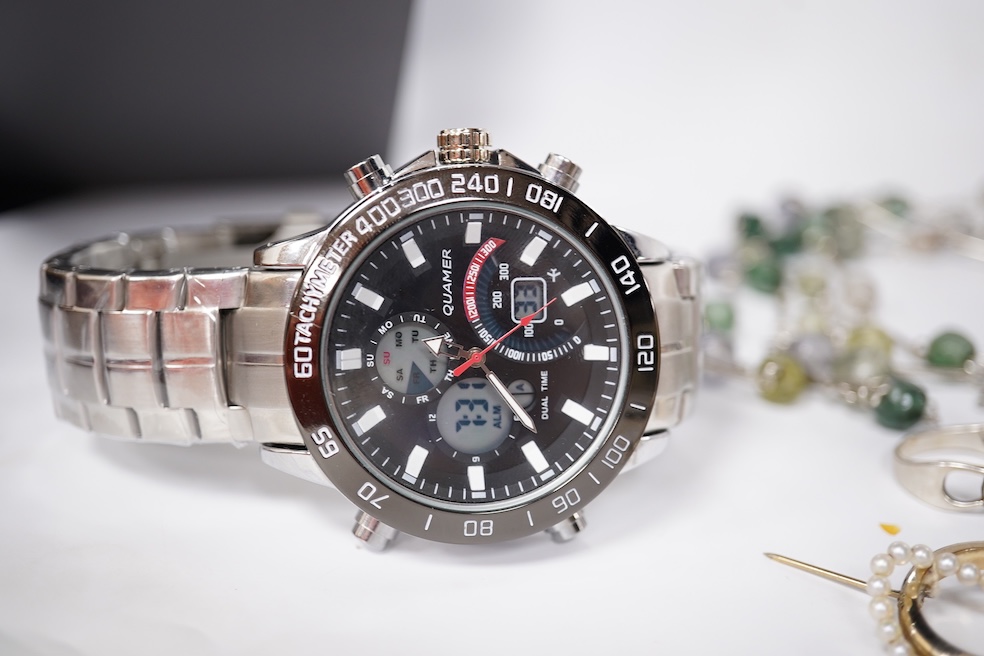 A small quantity of assorted mainly costume jewellery including a pair of malachite earrings and a graduated coral bead necklace, together with an Omega watch box and a gentleman's Quamer quartz wrist watch. Condition -